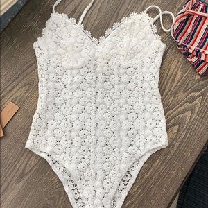 White body suit. Open/see through floral body